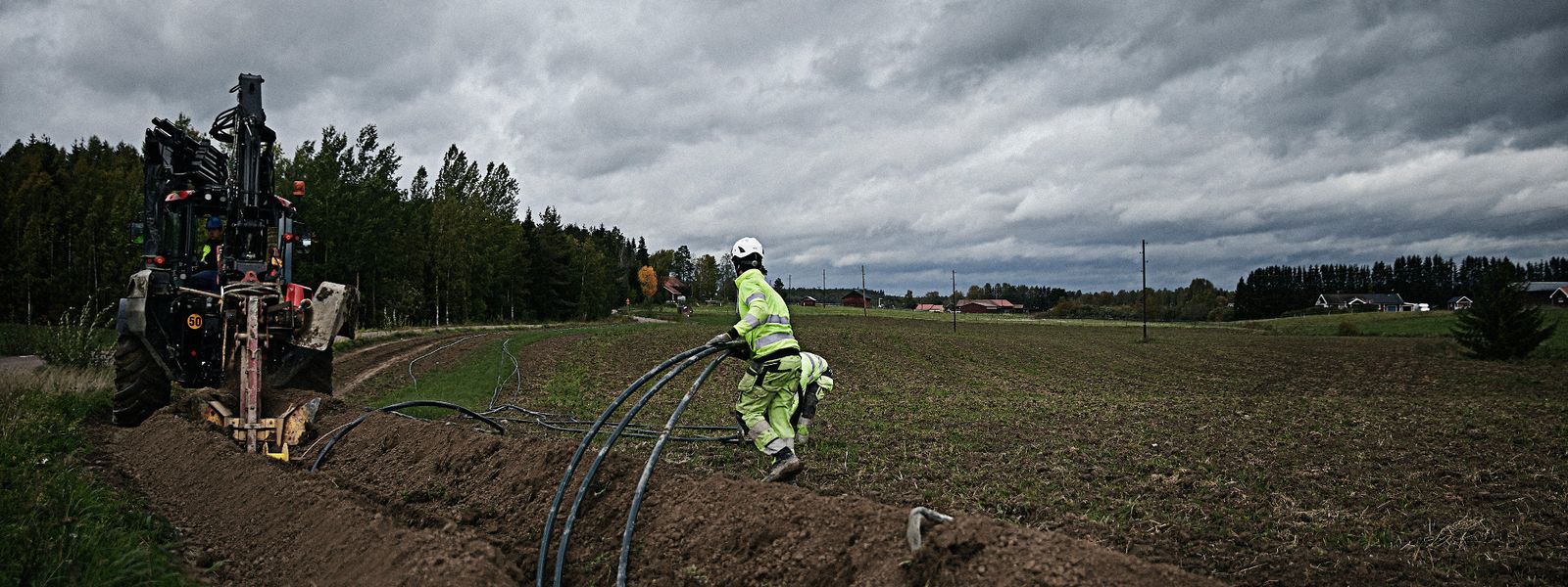 Cable workers installing a medium voltage cable